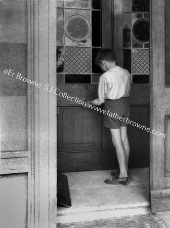 BOY AT DOOR OF MOUNT ST ANNE'S